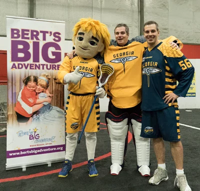 Mascot Stinger, Brian Moote of The Bert Show and Swarm defenseman Drew Petkoff